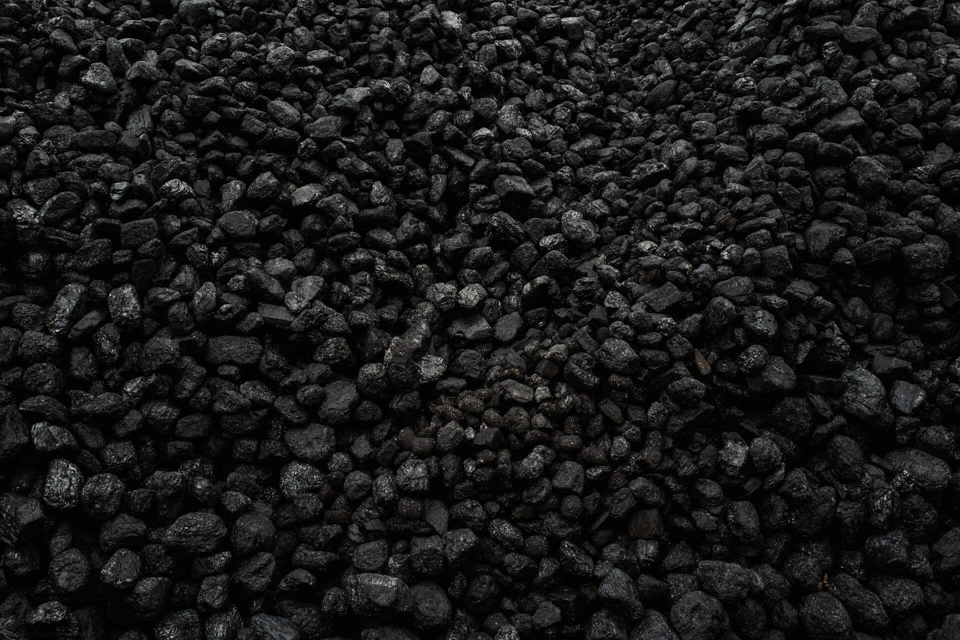 Close-up of dark activated carbon filling the frame